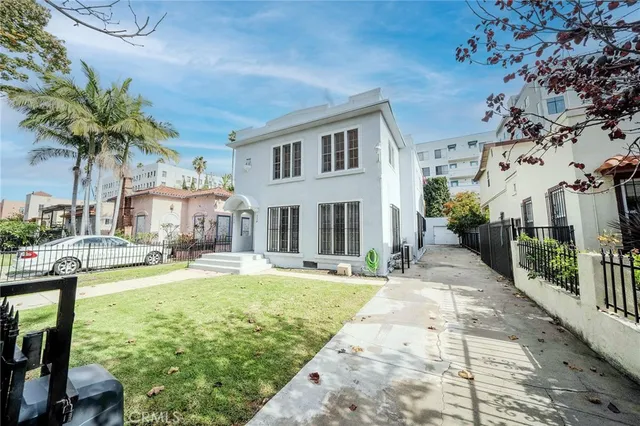 a swimming pool with outdoor seating and yard