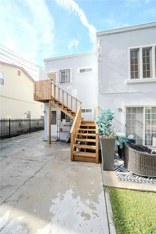a view of washer and dryer with kitchen in the background