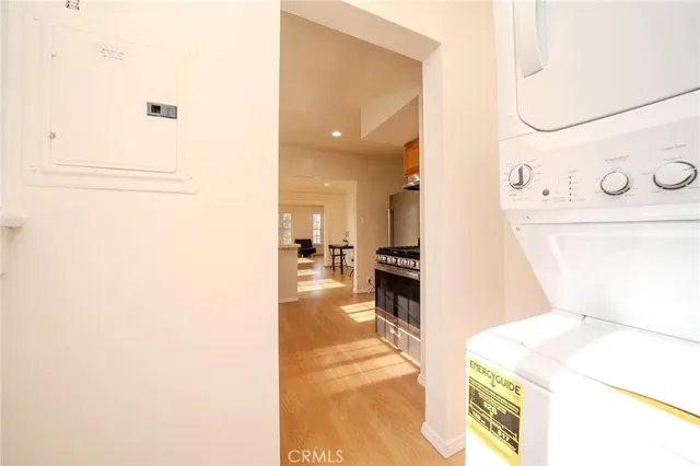 a view of a kitchen with a refrigerator and a sink