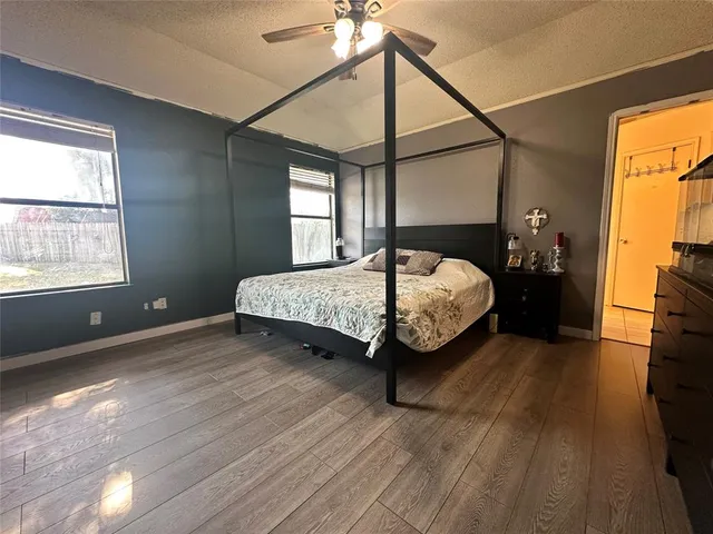 a bedroom with a bed and window