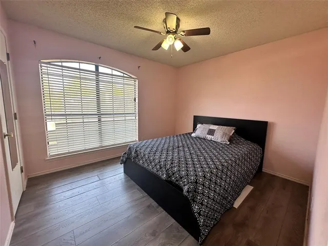 a bedroom with bed and window