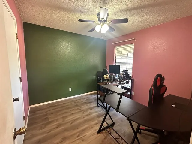 a workspace with furniture and chandelier