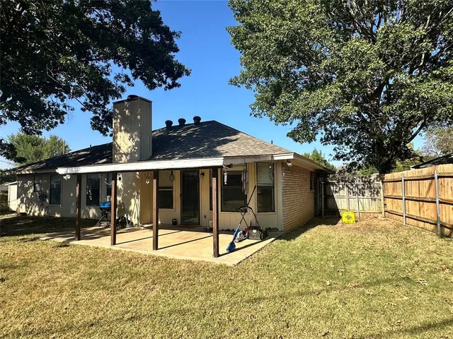 a view of a house with snow in the background
