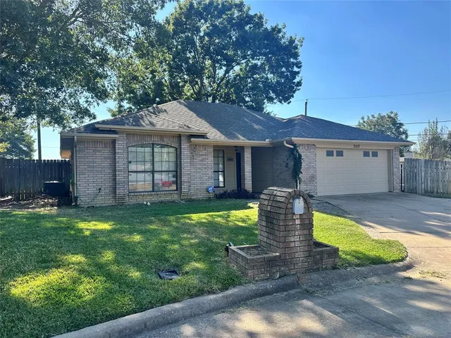 a view of a house with pool and a small yard
