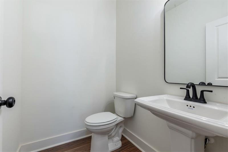 131 Old Alabama Road Southeast Emerson, GA 30137 - Photo 36 of 44 a bathroom with a sink a toilet and mirror