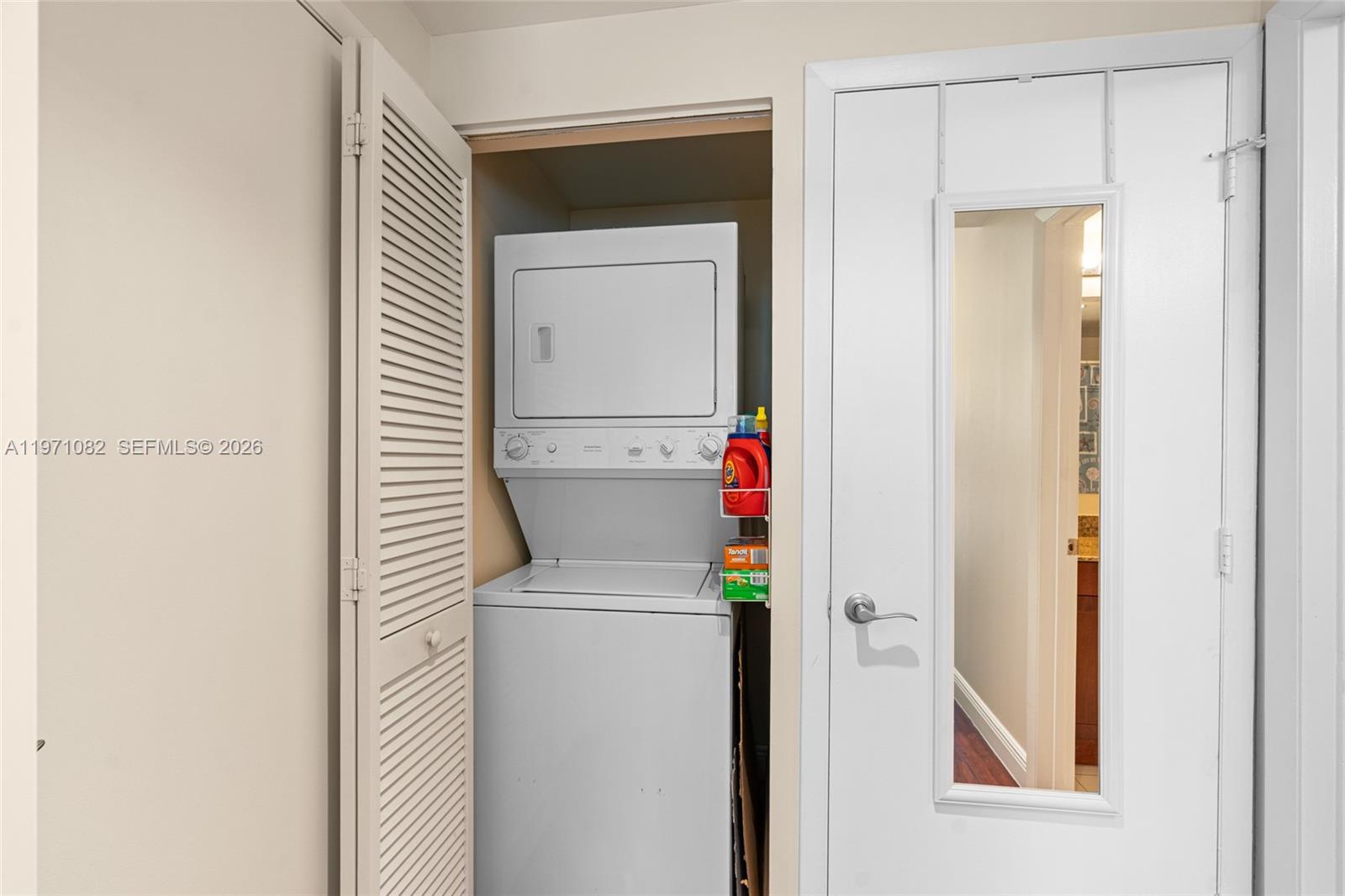 7275 Southwest 90th Way, Unit 404 Miami, FL 33156 - Photo 21 of 35 a utility room with dryer and washer