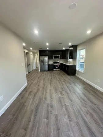 a view of a kitchen with a sink and a microwave
