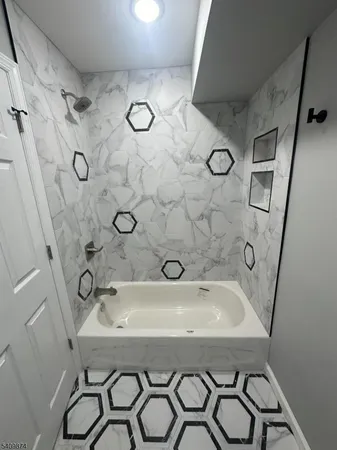 a bathroom with a sink and shower