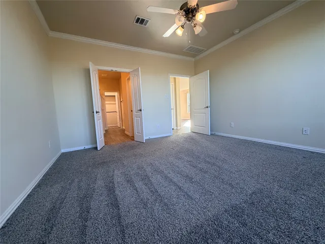 a view of an empty room and a window