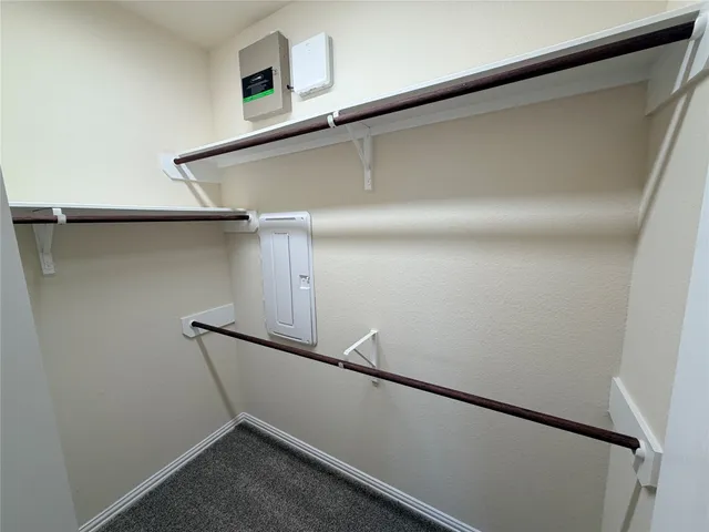 a bathroom with a double vanity sink toilet and shower