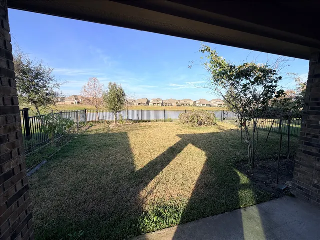 a view of a backyard with green space
