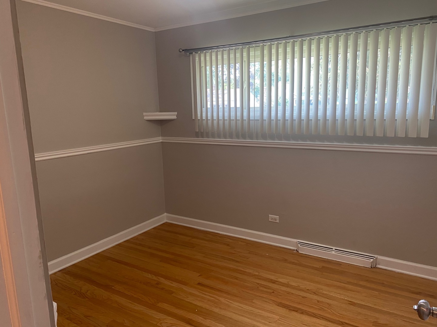 1009 Dell Road Northbrook, IL 60062 - Photo 11 of 15 a view of an empty room with wooden floor and a window