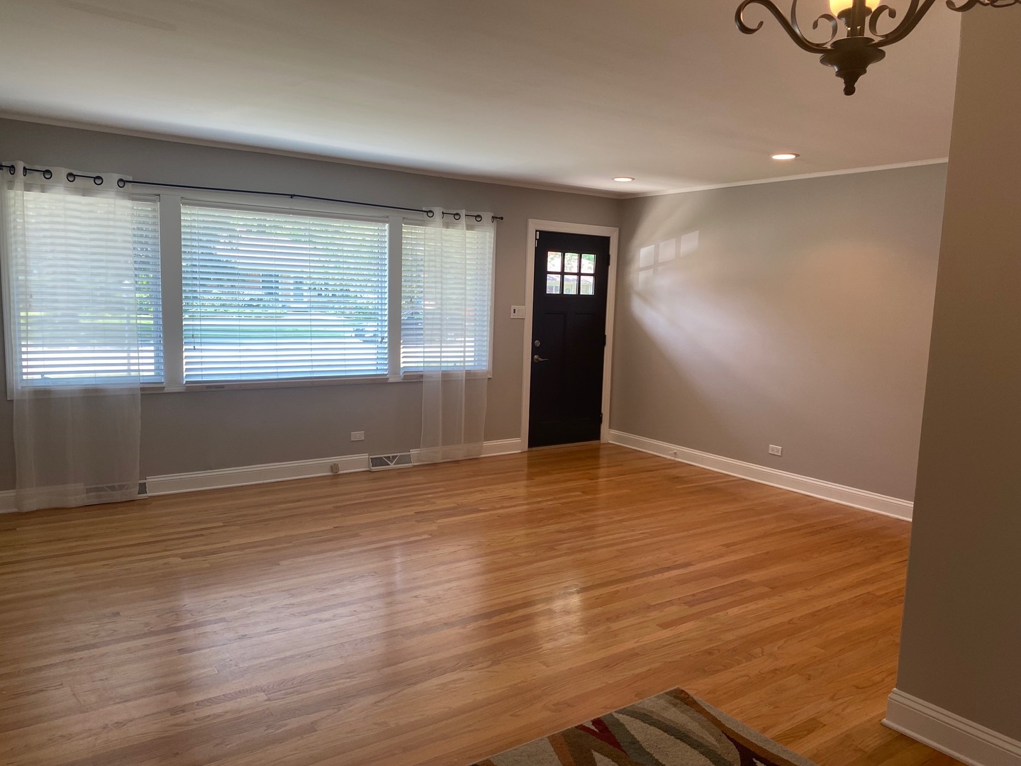 1009 Dell Road Northbrook, IL 60062 - Photo 3 of 15 an empty room with wooden floor and windows