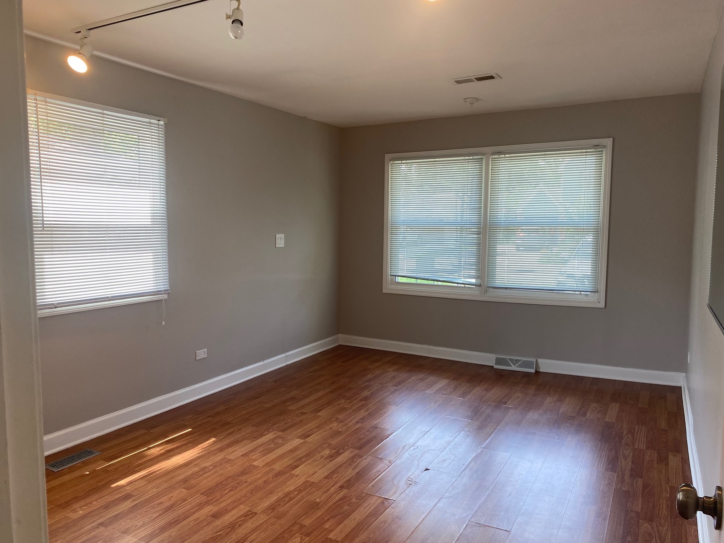 1009 Dell Road Northbrook, IL 60062 - Photo 7 of 15 a view of an empty room with wooden floor and a window