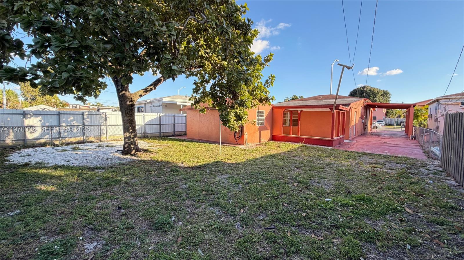 309 East 18th Street Hialeah, FL 33010 - Photo 15 of 15 a view of a house with backyard and tree