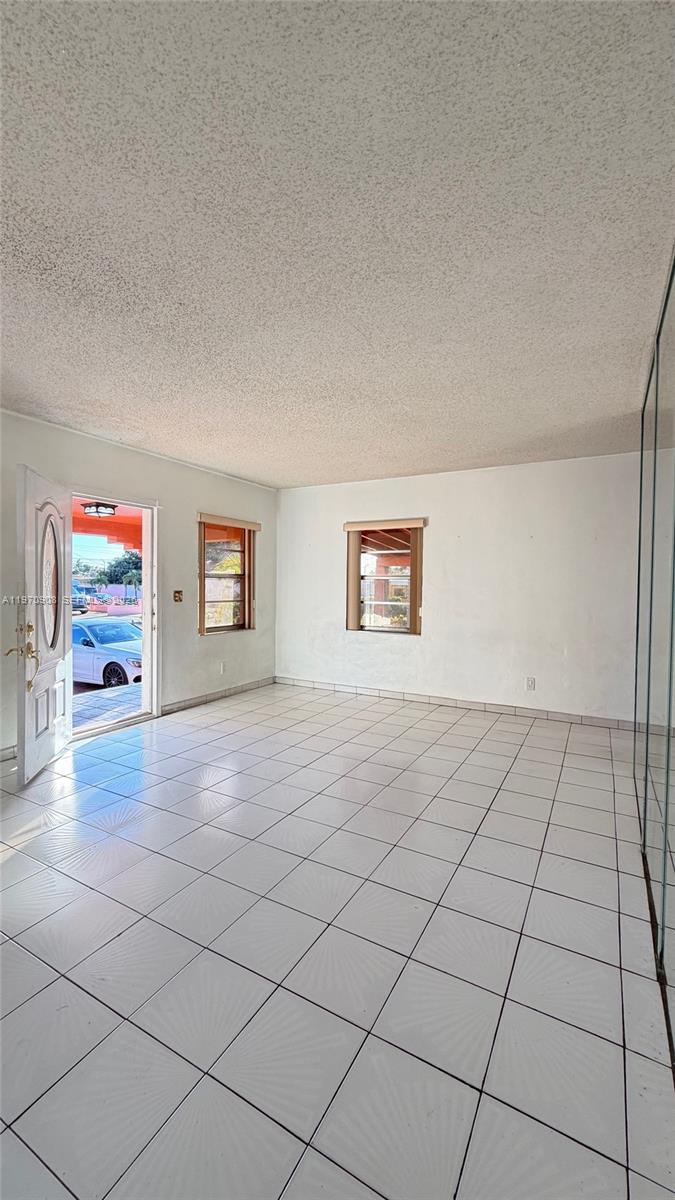 309 East 18th Street Hialeah, FL 33010 - Photo 3 of 15 a view of a livingroom and entryway