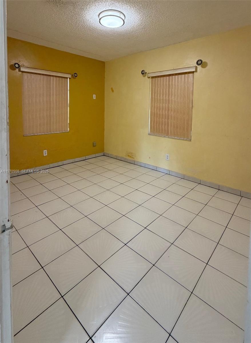 309 East 18th Street Hialeah, FL 33010 - Photo 5 of 15 a view of an empty room and chandelier fan