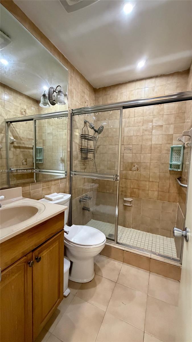 309 East 18th Street Hialeah, FL 33010 - Photo 6 of 15 a bathroom with a shower toilet and sink