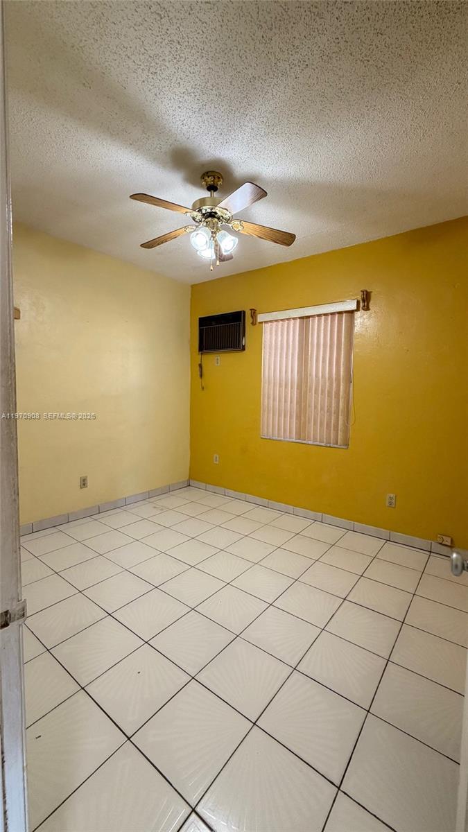 309 East 18th Street Hialeah, FL 33010 - Photo 7 of 15 a view of a livingroom with a chandelier fan and window