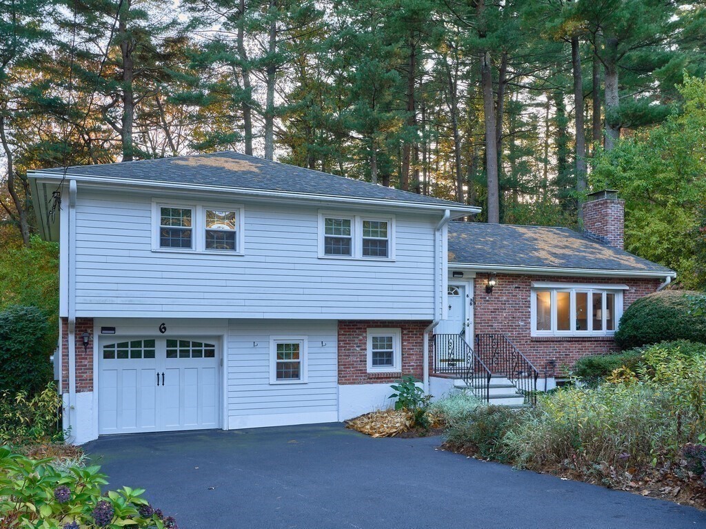 6 Holbrook Road Wayland, MA 01778 - Photo 1 of 23 a front view of a house with a garden