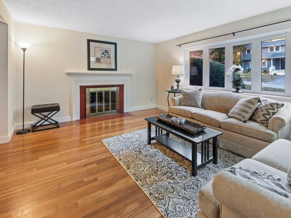 6 Holbrook Road Wayland, MA 01778 - Photo 3 of 23 a living room with furniture and a fireplace
