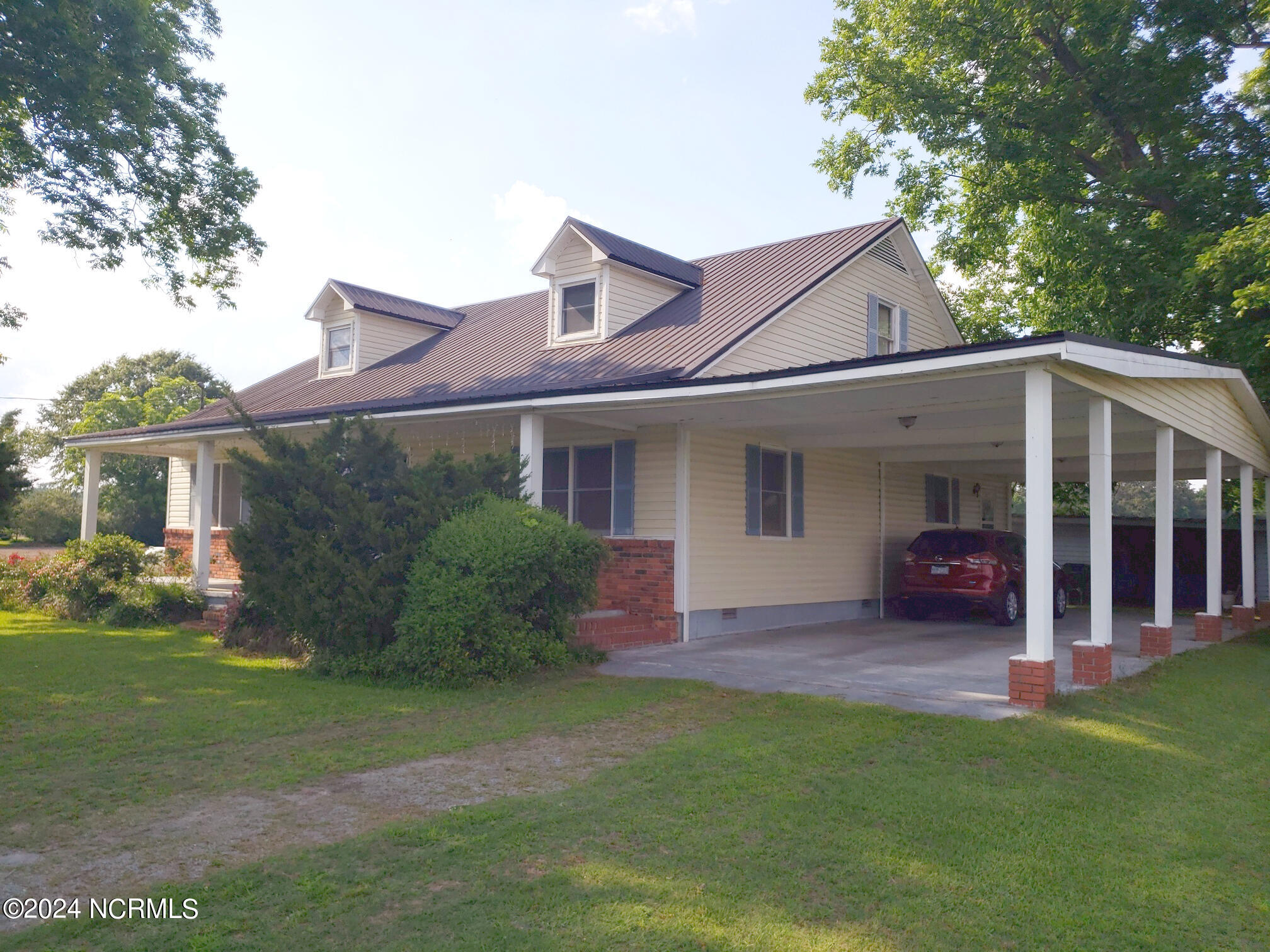 473 Forehand Road Pikeville, NC 27863 - Photo 2 of 33 HUGE FRONT PORCH! DEEP CARPORT!