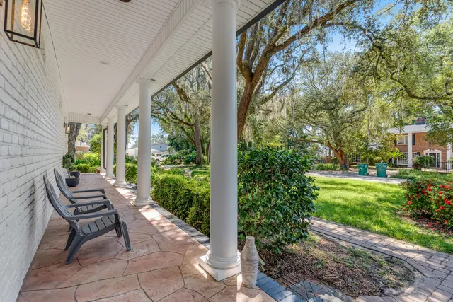 a view of a room with lots of furniture and wooden floor