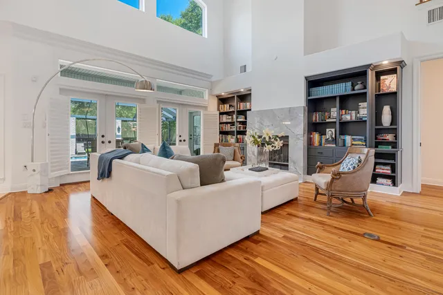 a kitchen with stainless steel appliances granite countertop white cabinets and a refrigerator
