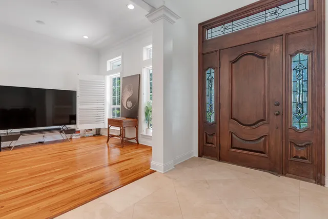 a spacious bedroom with a large bed and a large window