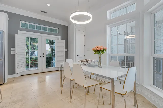 a spacious bedroom with a bed and a workspace