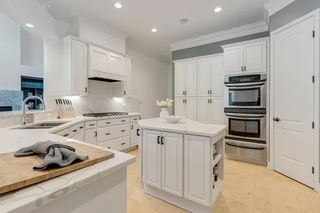 a view of a two chairs in the balcony