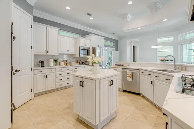 a spacious bedroom with a bed and a cabinets