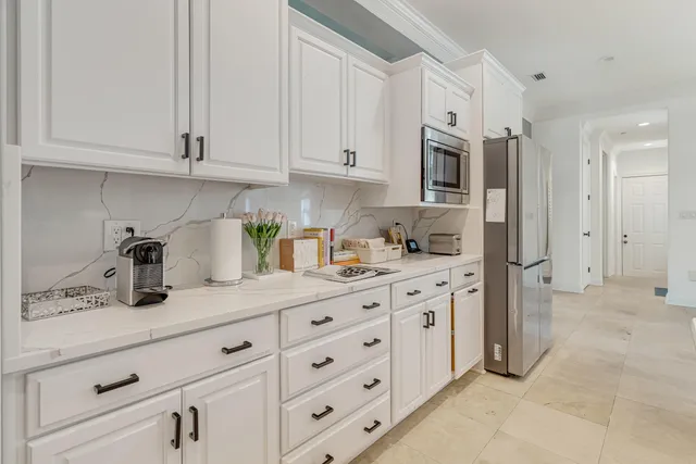 a view of a hallway with wooden floor and stairs