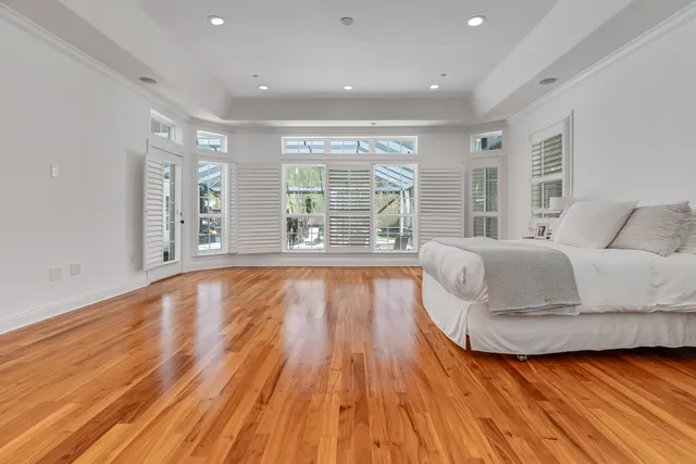 a bathroom with a granite countertop sink toilet and mirror