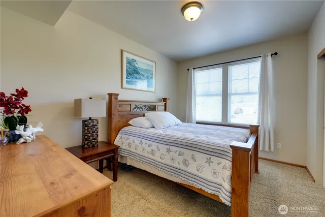 a bedroom with a bed and a dresser