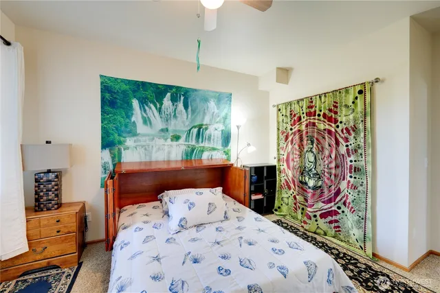 a bedroom with furniture and window