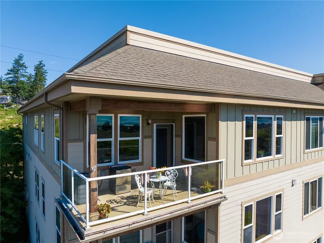 a front view of a house with large windows