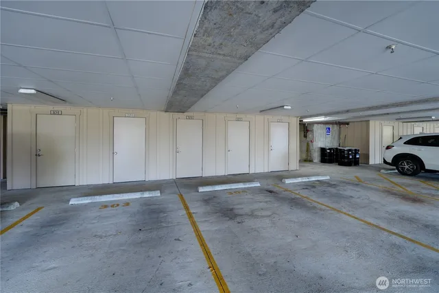 a view of parking area and garage