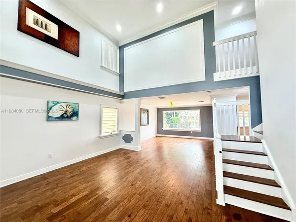 a view of balcony with wooden floor and fence