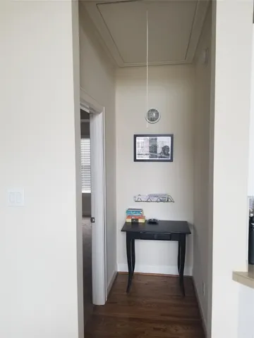 a white toilet sitting next to a white cabinet