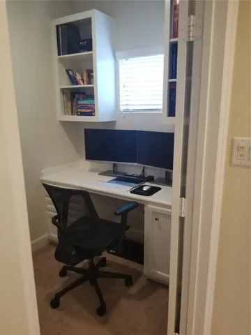 a view of a workspace with furniture