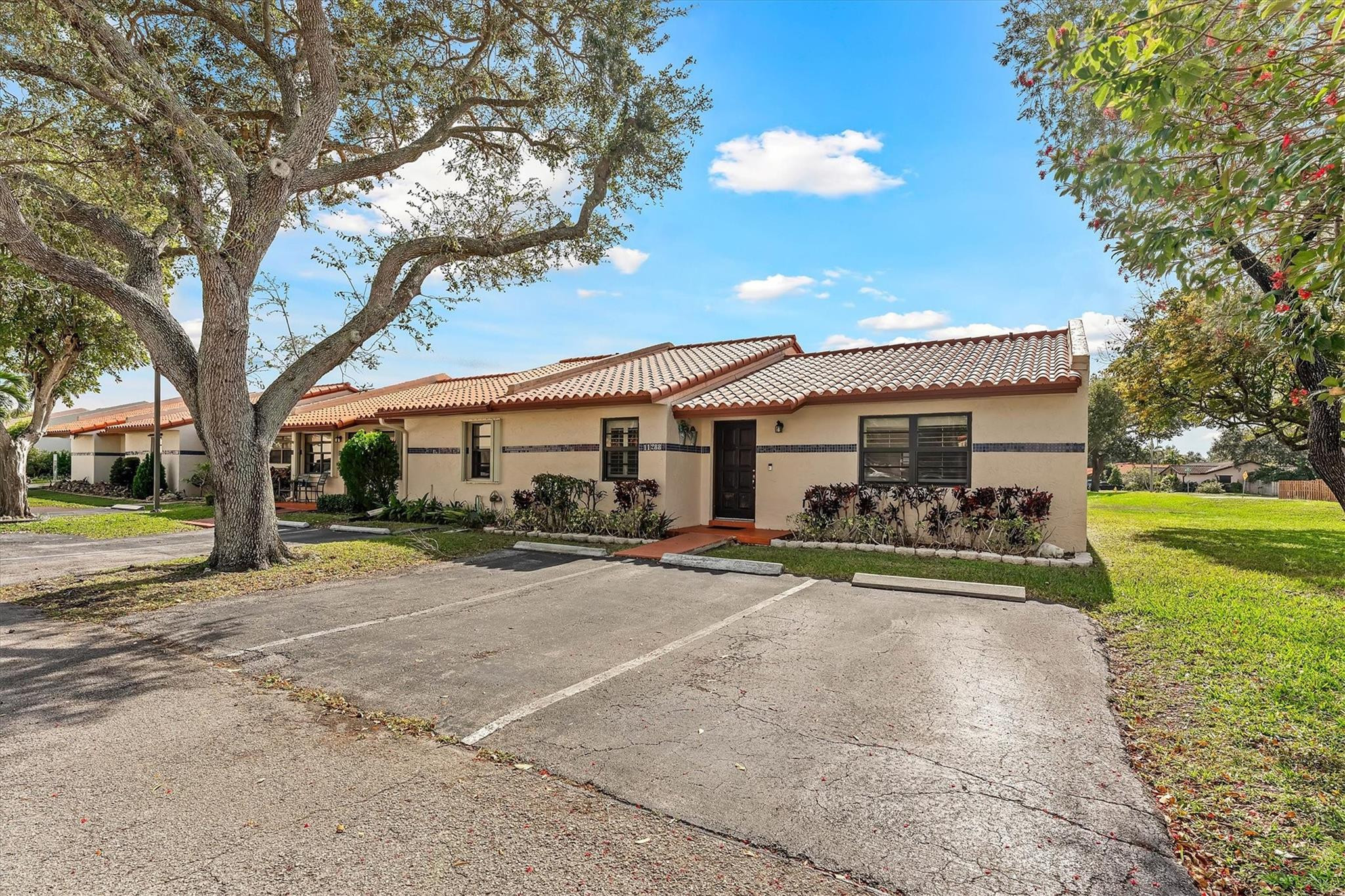 11288 Southwest 59th Court Cooper City, FL 33330 - Photo 1 of 32 a view of a house with a yard and large tree