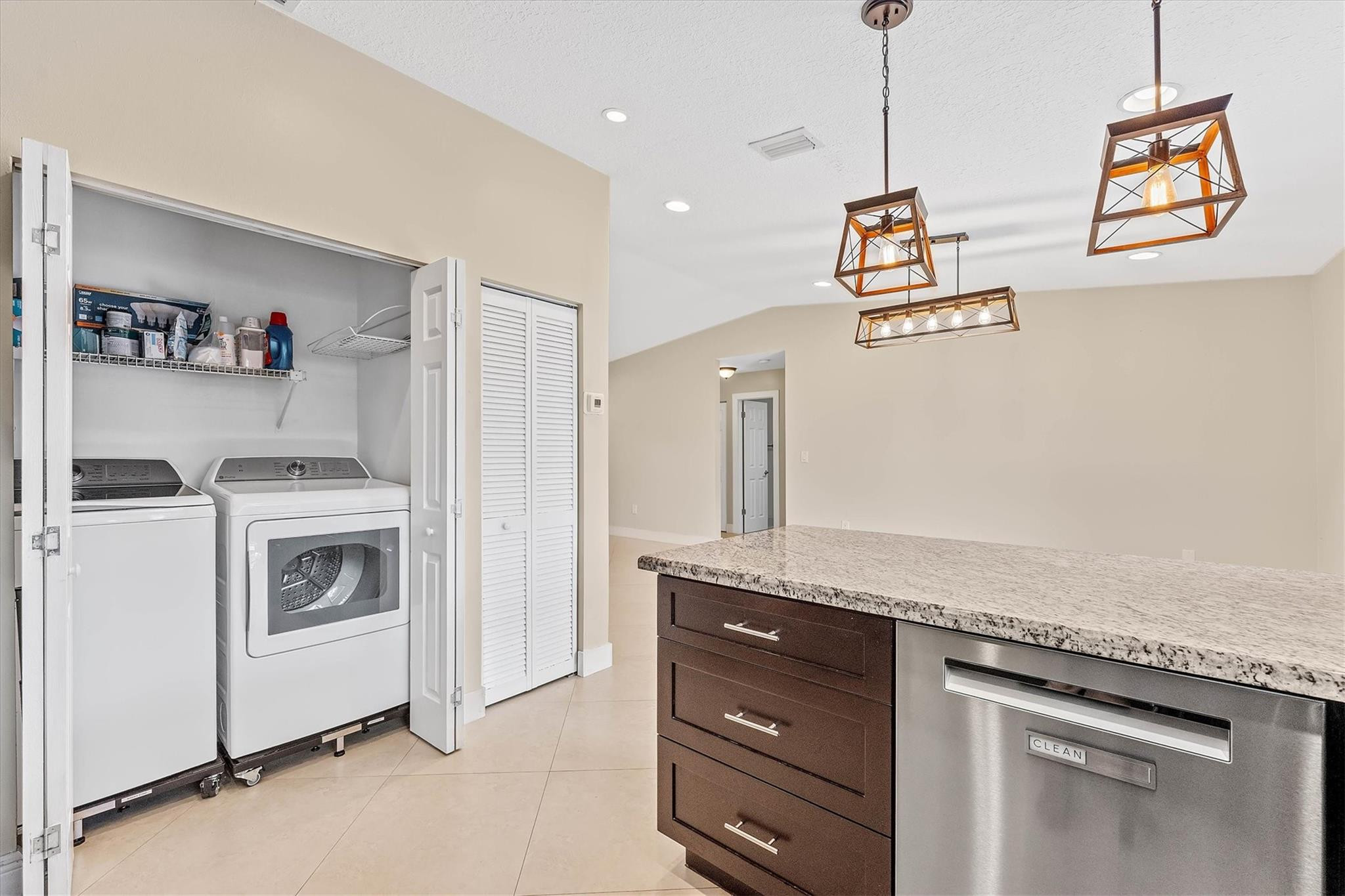 11288 Southwest 59th Court Cooper City, FL 33330 - Photo 12 of 32 a kitchen with granite countertop white cabinets and white appliances