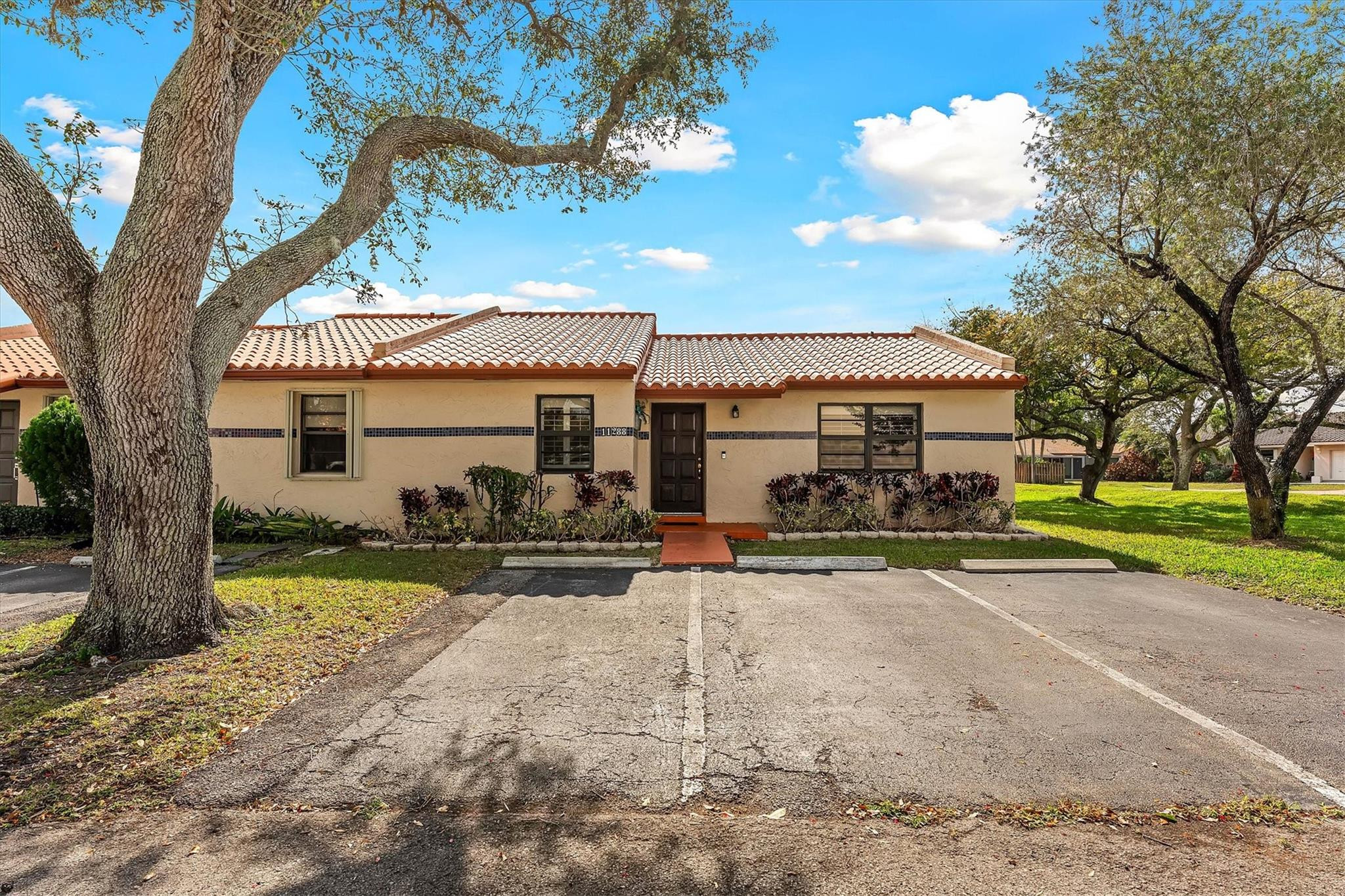 11288 Southwest 59th Court Cooper City, FL 33330 - Photo 2 of 32 a view of a house with a yard and large tree