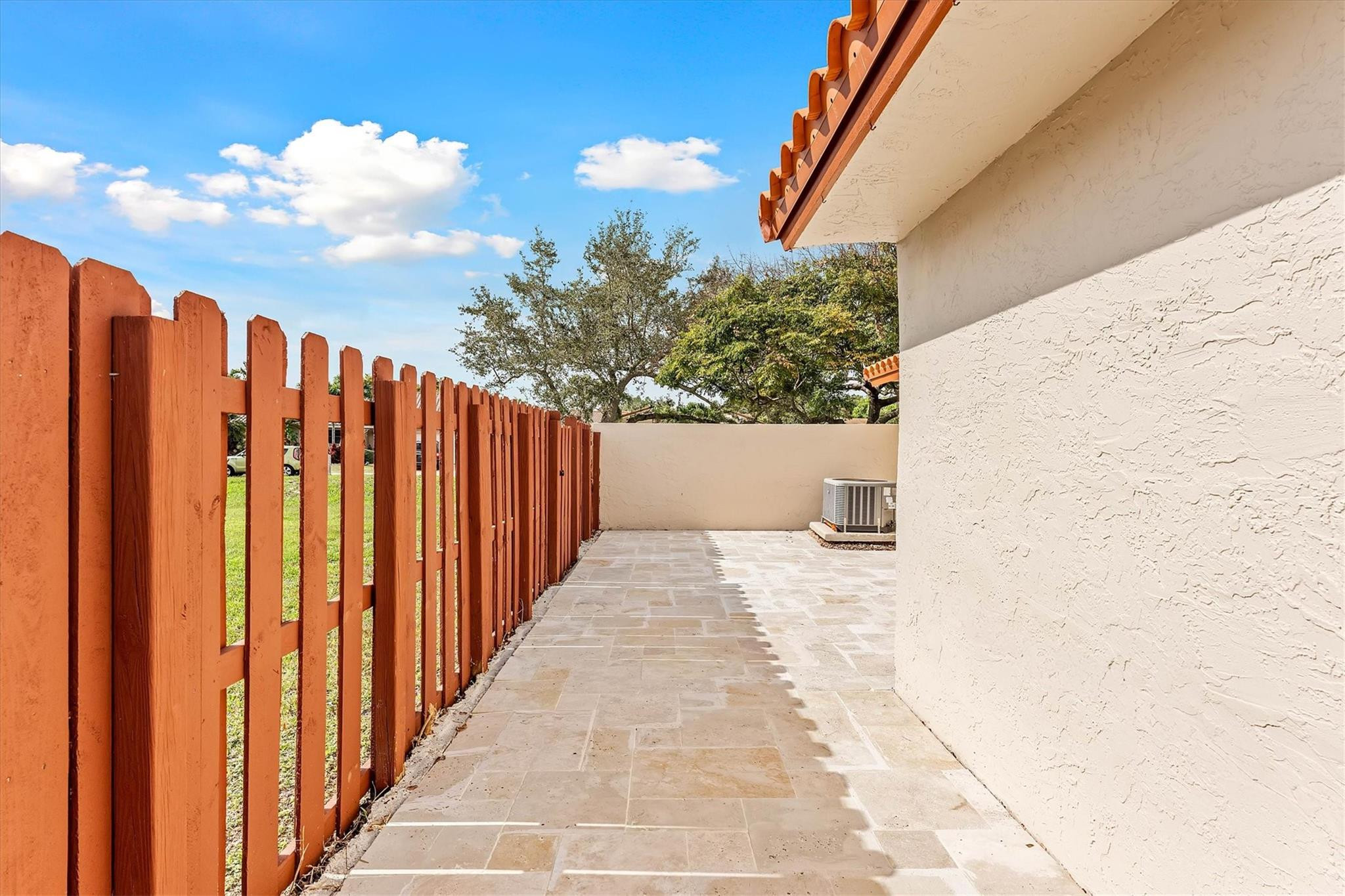 11288 Southwest 59th Court Cooper City, FL 33330 - Photo 22 of 32 a view of a pathway of a building with wooden fence