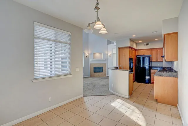 a view of a kitchen with refrigerator and microwave