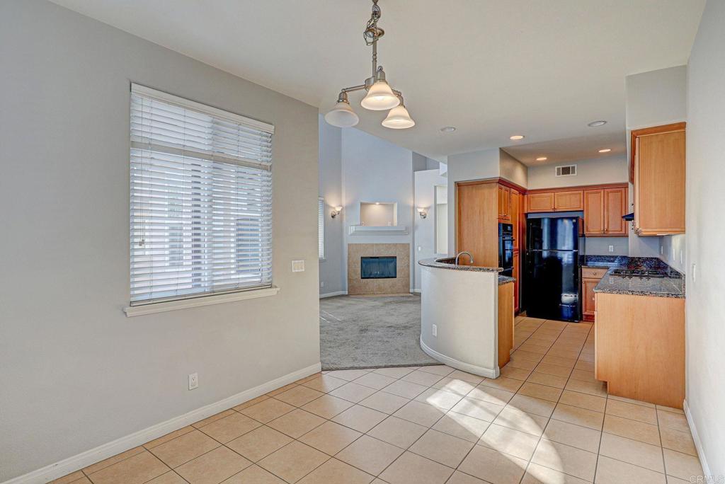 1575 South Escondido Boulevard Escondido, CA 92025 - Photo 5 of 6 a view of a kitchen with refrigerator and microwave