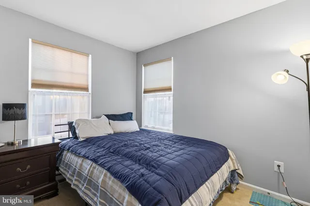 a balcony with table and chairs