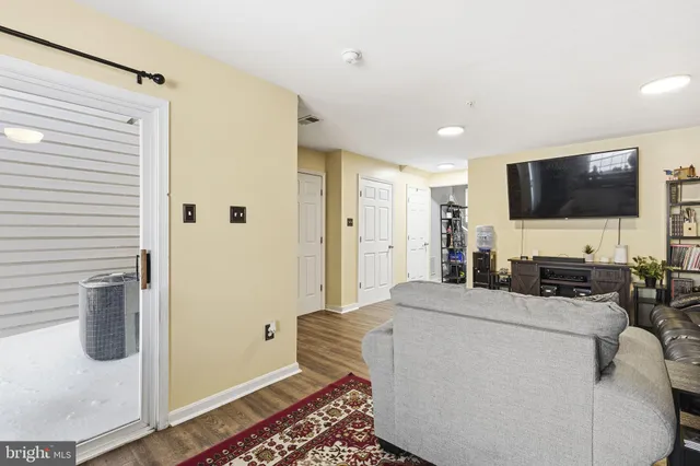 a kitchen with stainless steel appliances granite countertop a sink refrigerator and microwave