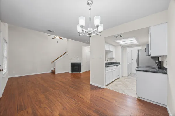 a view of a kitchen with microwave and stove